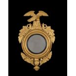 A George III carved giltwood convex wall mirror, circa 1810