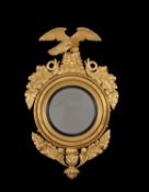 A George III carved giltwood convex wall mirror, circa 1810
