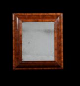 A William & Mary olivewood oyster veneered cushion framed wall mirror