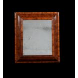 A William & Mary olivewood oyster veneered cushion framed wall mirror