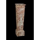 A Rouge marble pedestal in Neoclassical taste