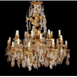 A fine French gilt bronze and cut glass hung twenty four light chandelier in Louis XV style
