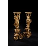 A pair of George I carved giltwood vase stands, circa 1720