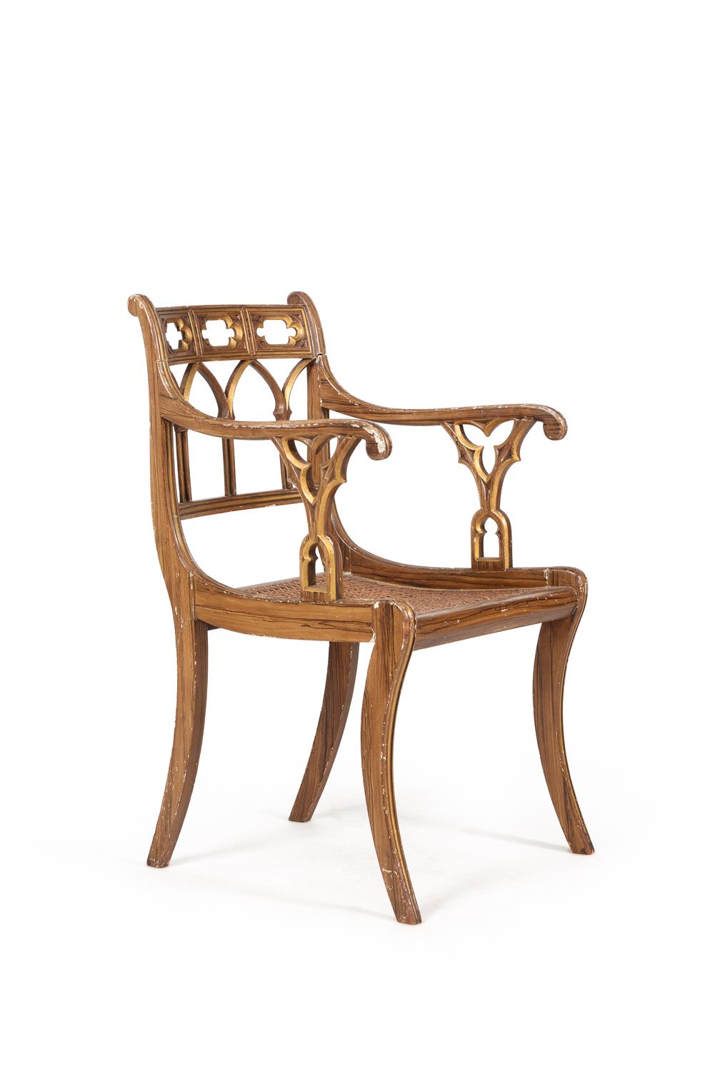 A Regency gothic revival simulated rosewood and parcel gilt armchair