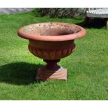 A substantial terracotta garden urn