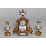 A French gilt metal and Sevres-style clock garniture