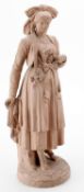 A French pink terracotta figure of a young woman