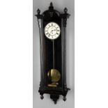 A late 19th century ebonised Vienna wall timepiece