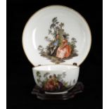 An 18th century Meissen porcelain cup and saucer