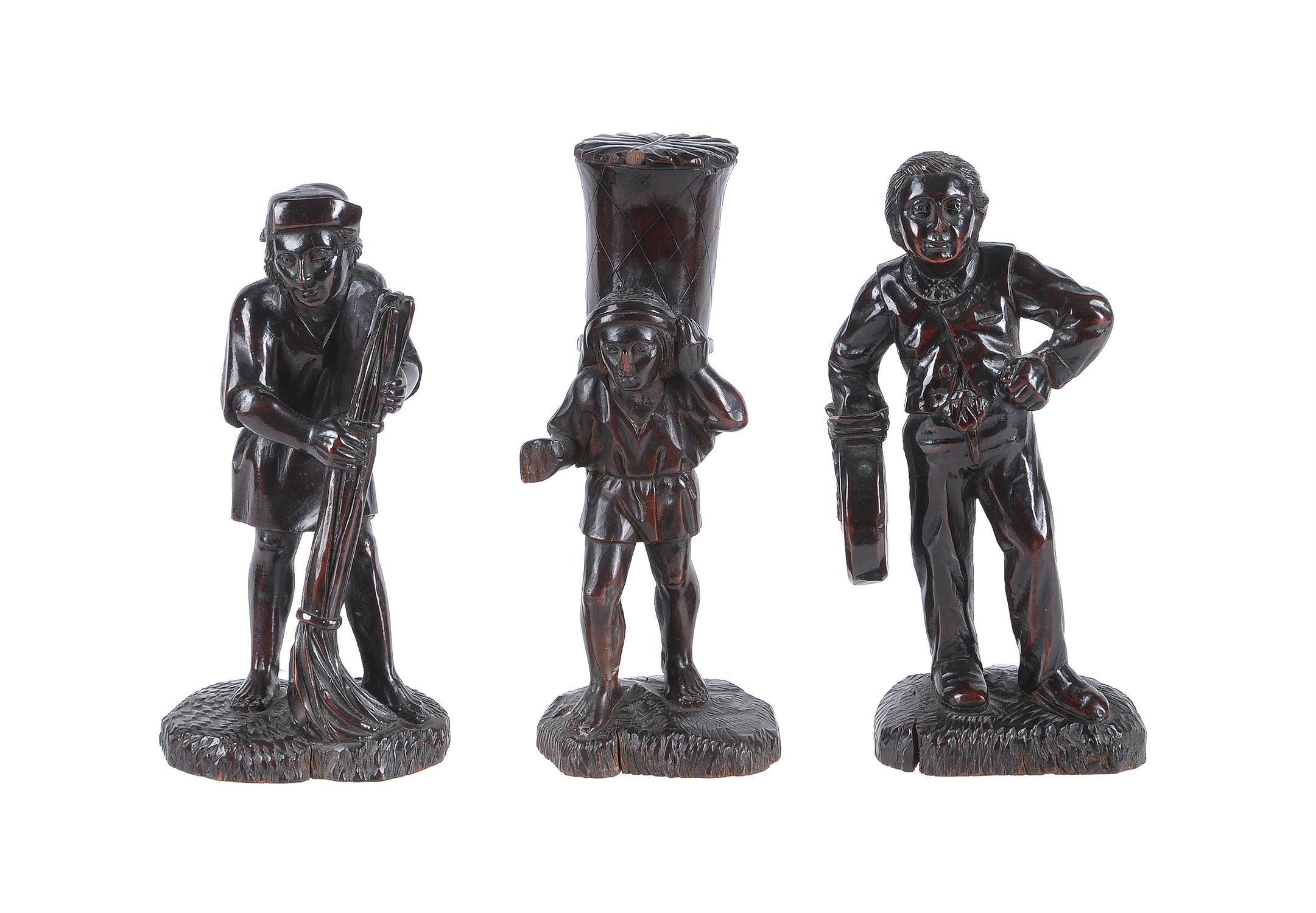 Three Continental carved and stained treen rustic figures