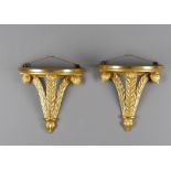 A pair of carved giltwood "Prince of Wales" feather wall brackets