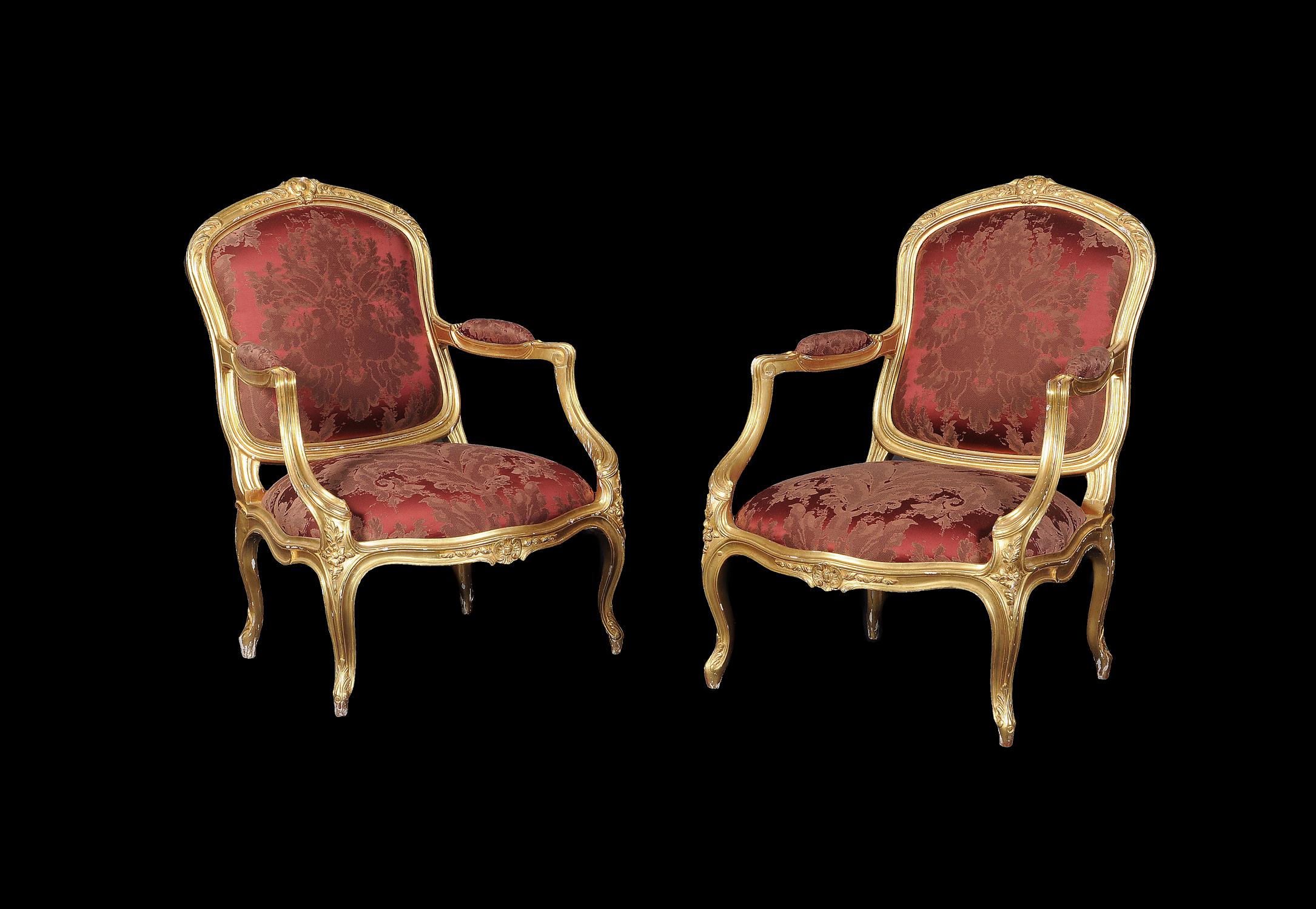 A pair of giltwood and upholstered armchairs in Louis XV style