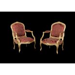 A pair of giltwood and upholstered armchairs in Louis XV style
