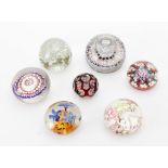 A group of seven various paperweights