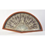 Y A glazed mahogany cased mother-of-pearl and lace fan