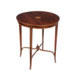 An Edwardian mahogany occasional table