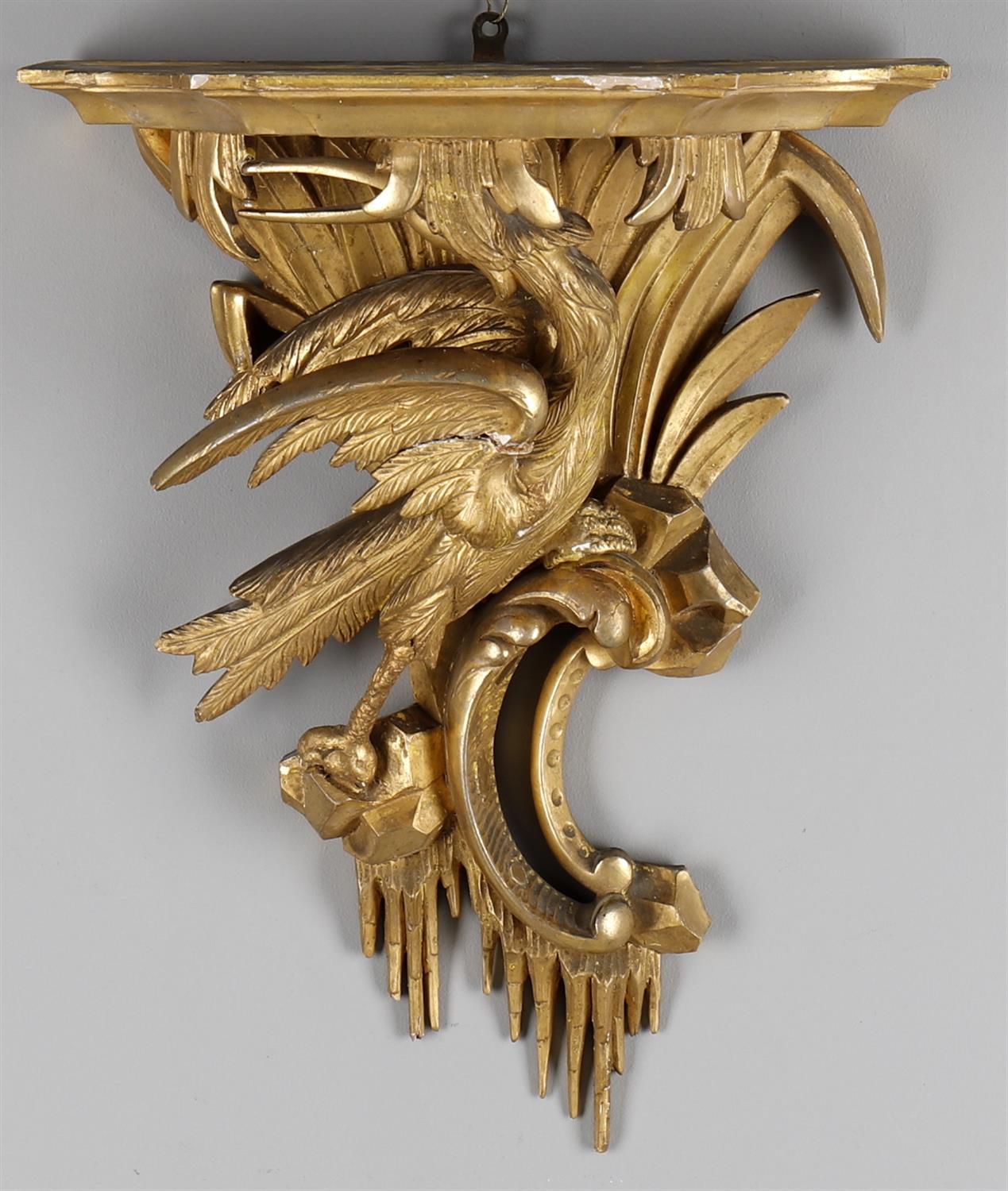 A carved giltwood wall bracket after a design by Chippendale