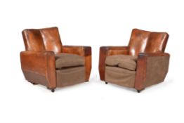 A pair of brown leather upholstered armchairs