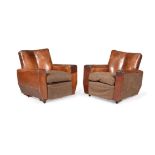 A pair of brown leather upholstered armchairs