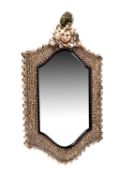 A shell clad wall mirror in the manner of 18th century giltwood examples