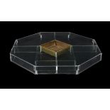 A Perspex and glass octagonal low centre table