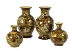 Two pairs of Doulton faience vases