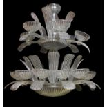 A large moulded clear glass seventeen light chandelier in Art Deco style