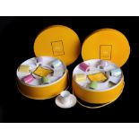 Two modern French porcelain boxed sets of six coffee cans and saucers for Christian Lacroix