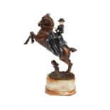 Y After Maximilien Fiot (1866-1953), a patinated bronze, ivory and onyx model of an equestrienne