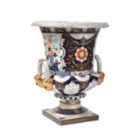A modern far Eastern porcelain Imari pattern campagna urn in the early 19th century Derby manner