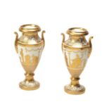 A pair of Paris porcelain two-handled vases decorated by Manteau