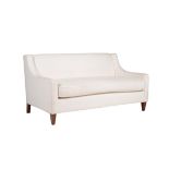 A cream upholstered two seater sofa