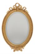 A giltwood oval wall mirror