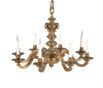 A French gilt bronze eight light chandelier in Regence taste