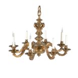 A French gilt bronze eight light chandelier in Regence taste