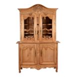 A French carved pine cabinet