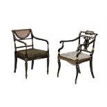 Two late George III or Regency ebonised and parcel gilt armchairs