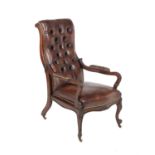 A Victorian walnut and leather upholstered reclining armchair
