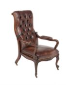 A Victorian walnut and leather upholstered reclining armchair