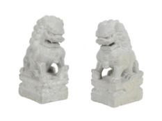 A pair of carved stone garden ornaments