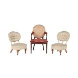 A pair of Victorian walnut and upholstered chairs