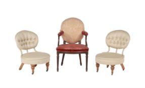 A pair of Victorian walnut and upholstered chairs