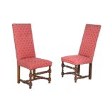 A set of eight walnut and upholstered dining chairs