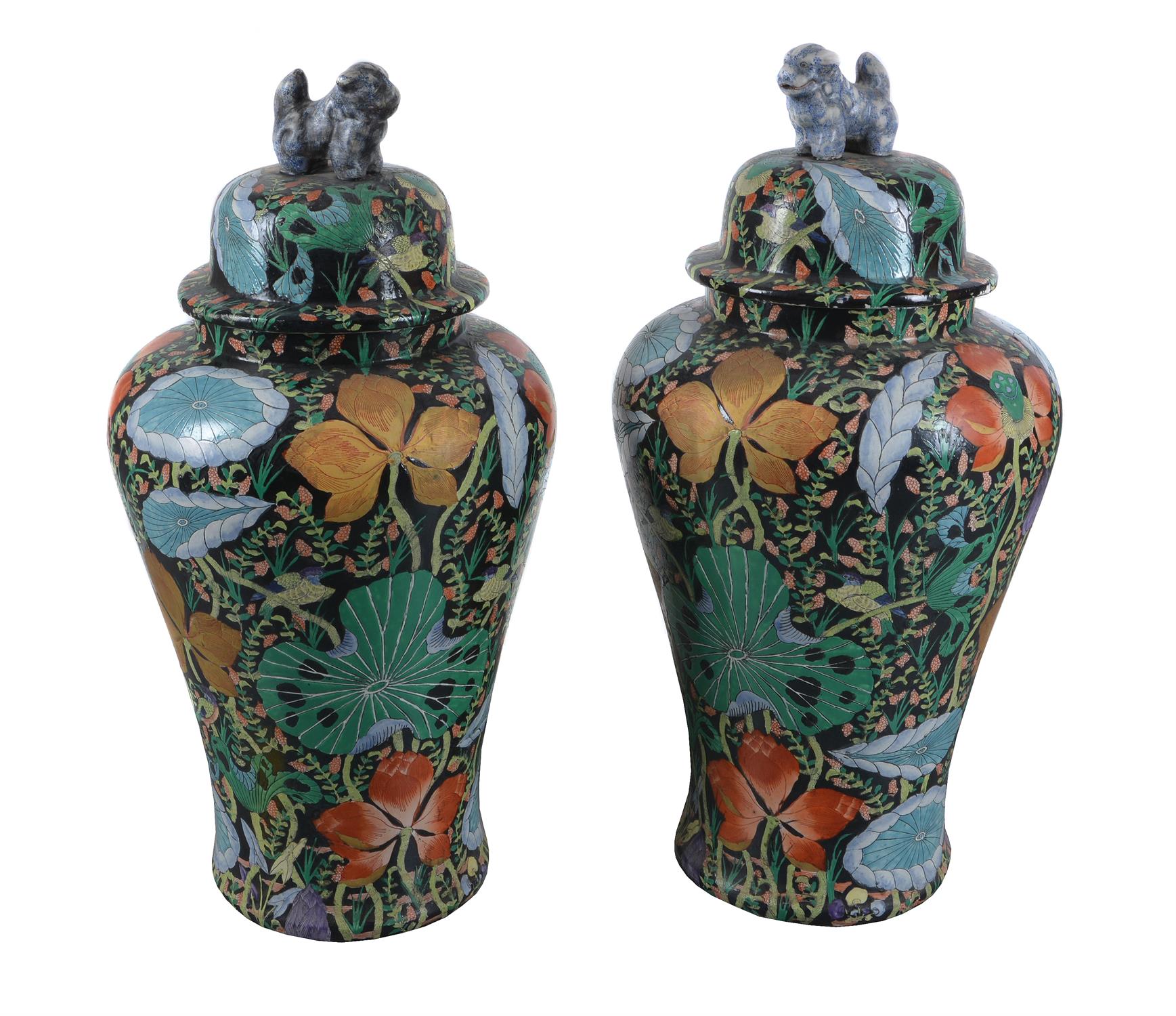 A pair of modern Asian famille noire style baluster floor vases and covers