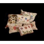 A group of six various needlework cushions