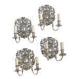 Two similar pairs of silvered metal twin light wall sconces in William & Mary taste