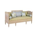 A distressed pine and upholstered sofa