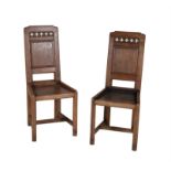 A pair of Gothic Revival oak hall chairs
