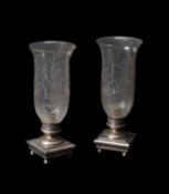 A pair of late Victorian or Edwardian glass and silver plated metal storm lanterns
