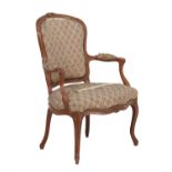 A French walnut and upholstered armchair in Louis XV style